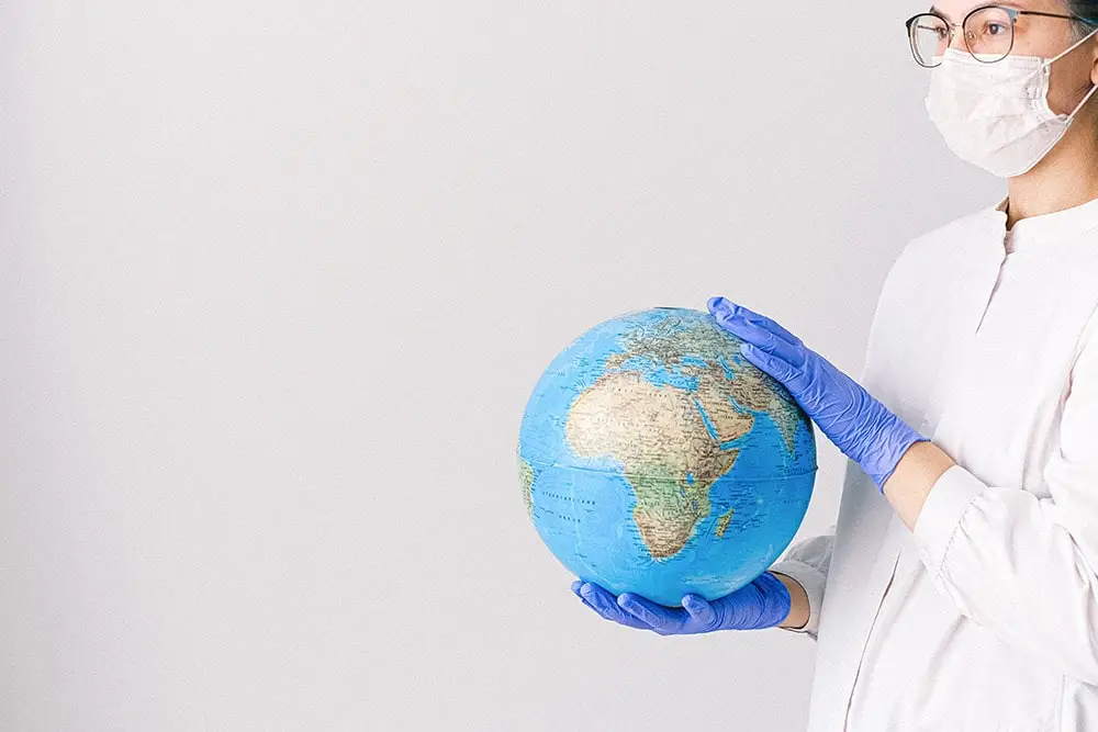 Civilization diseases: The doctor is holding a globe