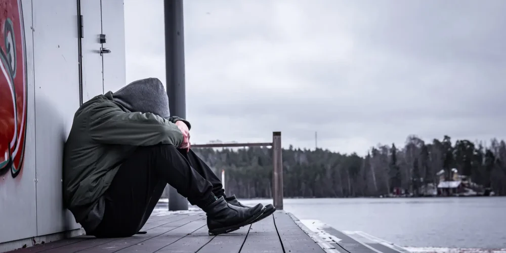 lonely-and-sad-man-sitting-on-the-ground-2023-11-27-04-51-33-utc (1)